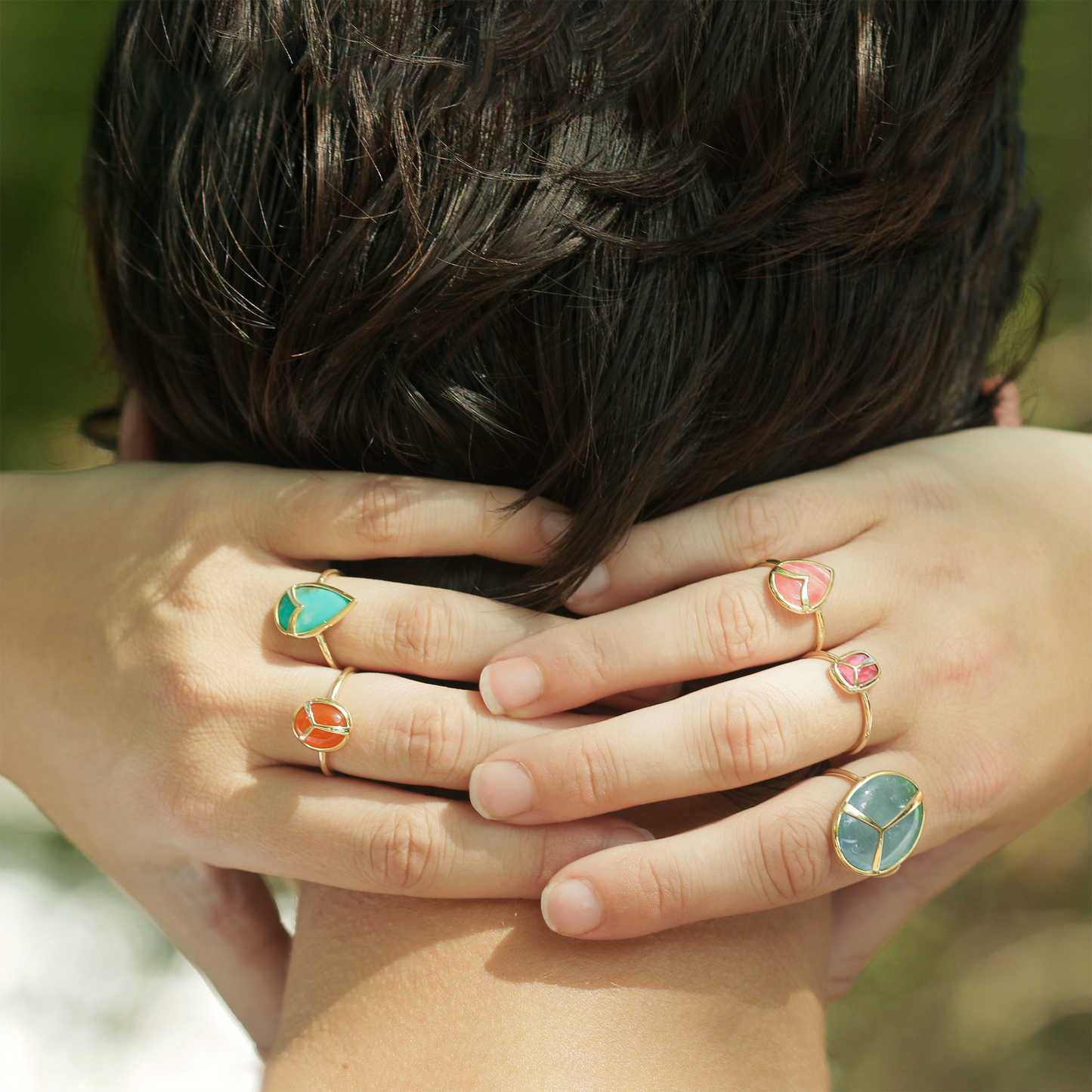 Woman modeling a variety of rings