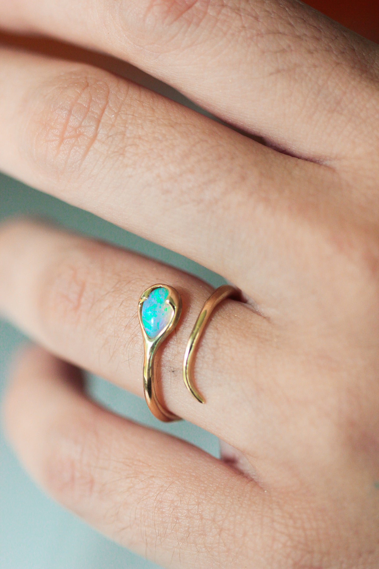 
                  
                    Serpent Ring in Crystal Opal and 18k Gold
                  
                