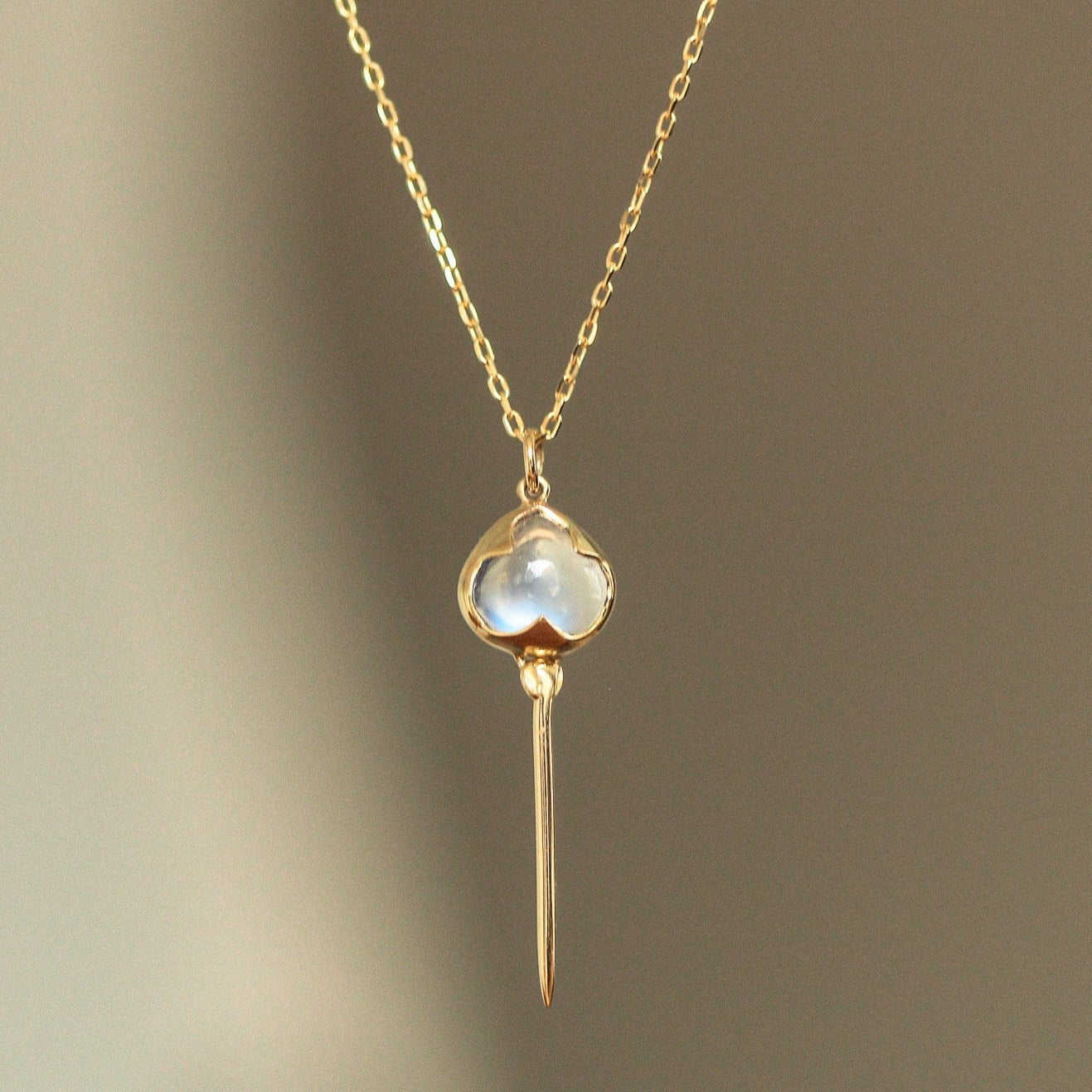 
                  
                    Stingray Necklace in Rainbow Moonstone and 18k Gold
                  
                