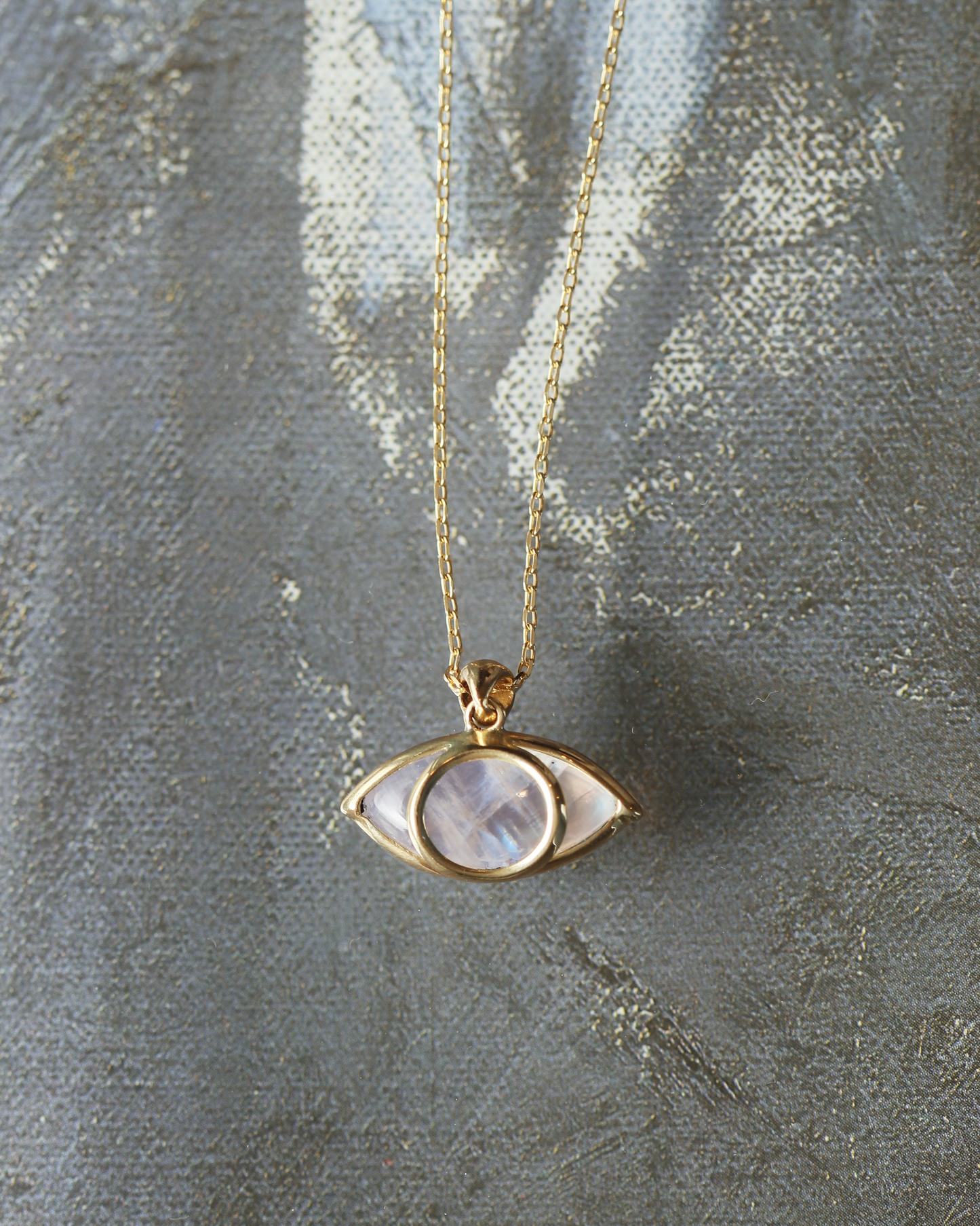 
                  
                    Third Eye Necklace in Rainbow Moonstone and 18k Gold
                  
                