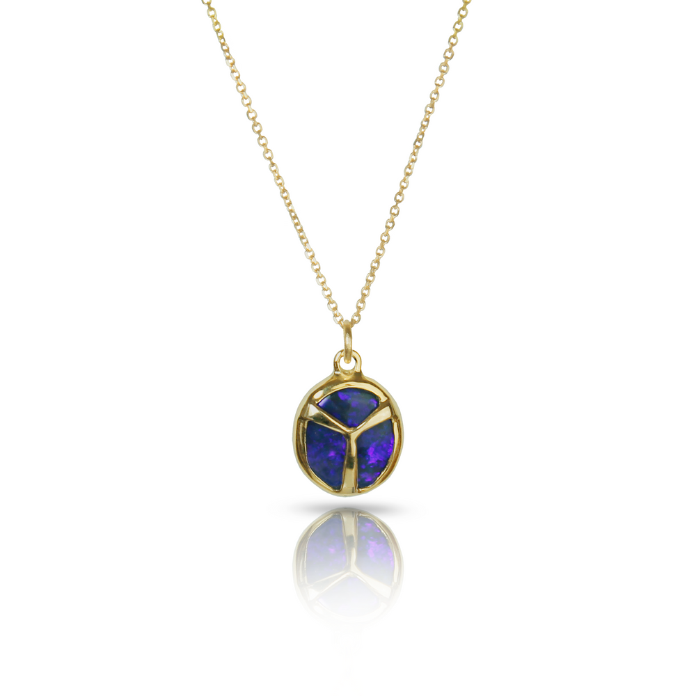 Yellow Gold Necklace Featuring Oval Shaped Dark blue and purple Opal Charm on a Gold Chain