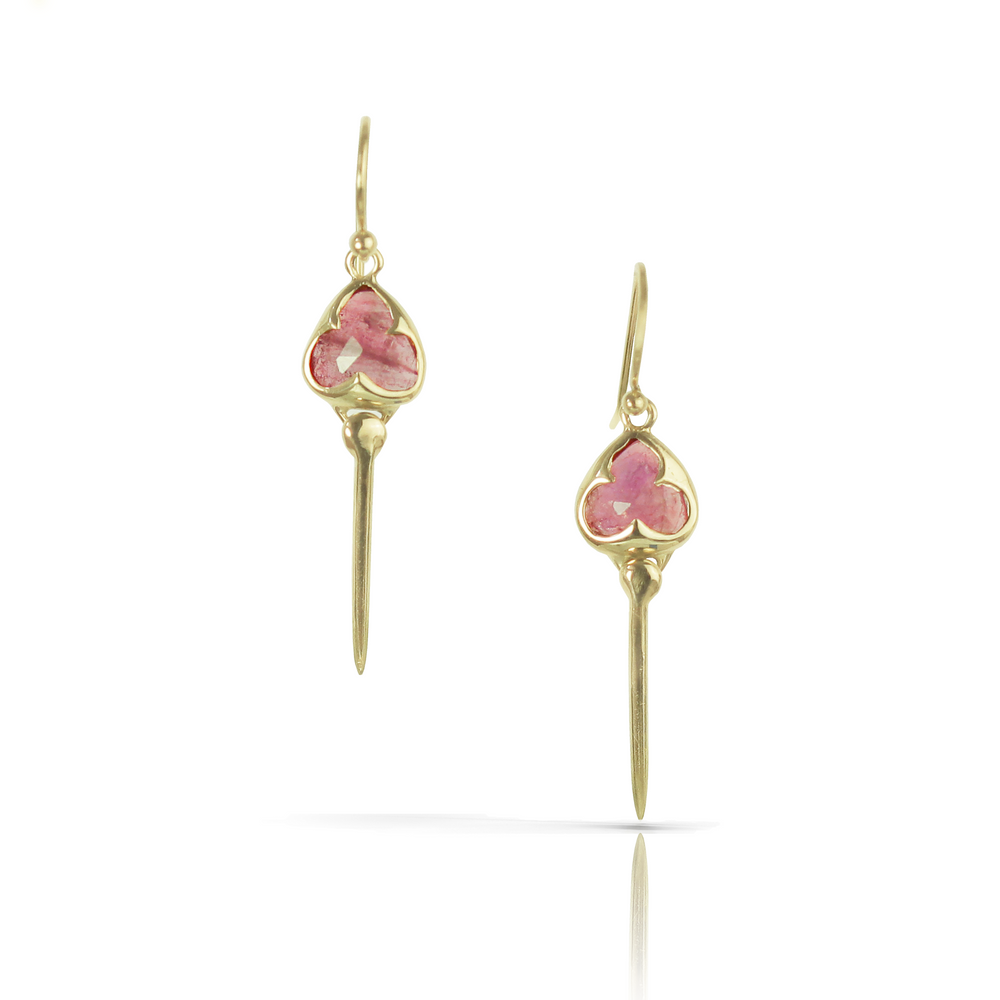 Yellow gold earrings with french hooks, bezel set pink tourmaline stones, and an elongated tail dangling from the bottom