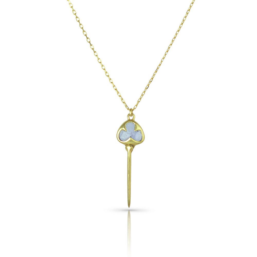 
                  
                    Yellow gold necklace with bezel set, pale purple tanzanite stone, and an elongated gold stingray tail dangling from the bottom, on a dainty gold chain
                  
                