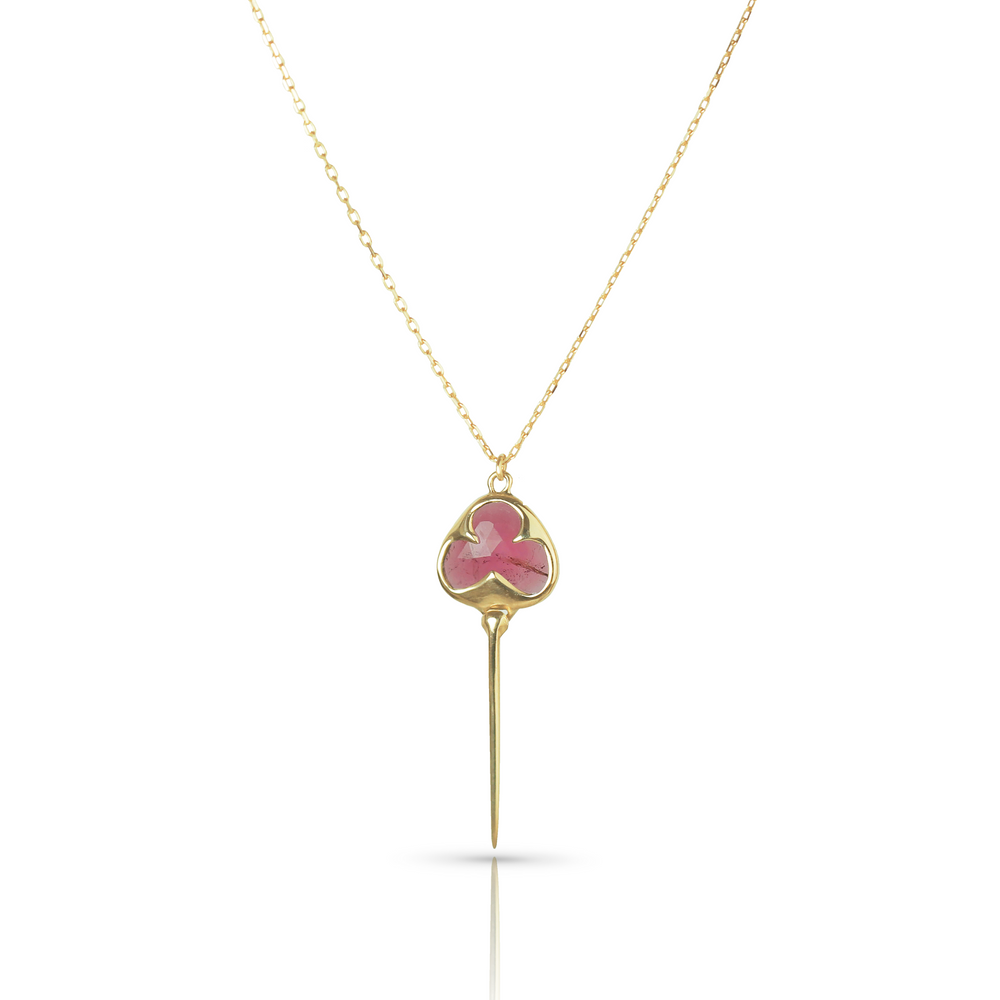
                  
                    Yellow gold necklace with bezel set pink tourmaline stone, and an elongated gold stingray tail dangling from the bottom, on a dainty gold chain
                  
                