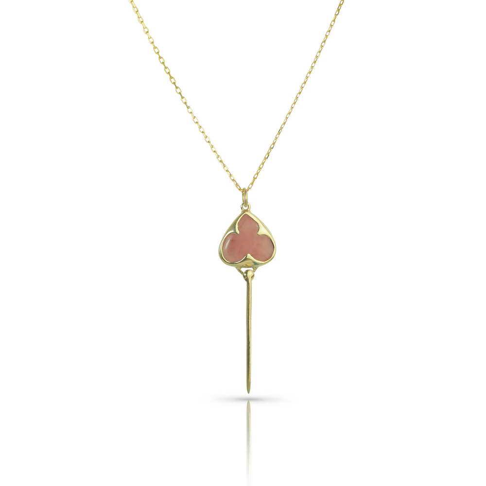 Yellow gold necklace with bezel set muted pink guava quartz stone, and an elongated gold stingray tail dangling from the bottom, on a dainty gold chain