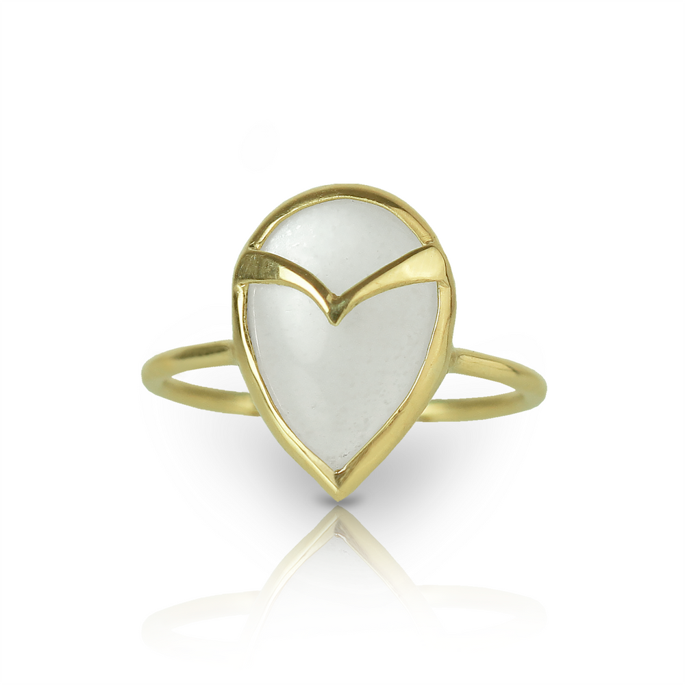 Yellow gold ring with a White teardrop-shaped moonstone, and gold owl beak detail