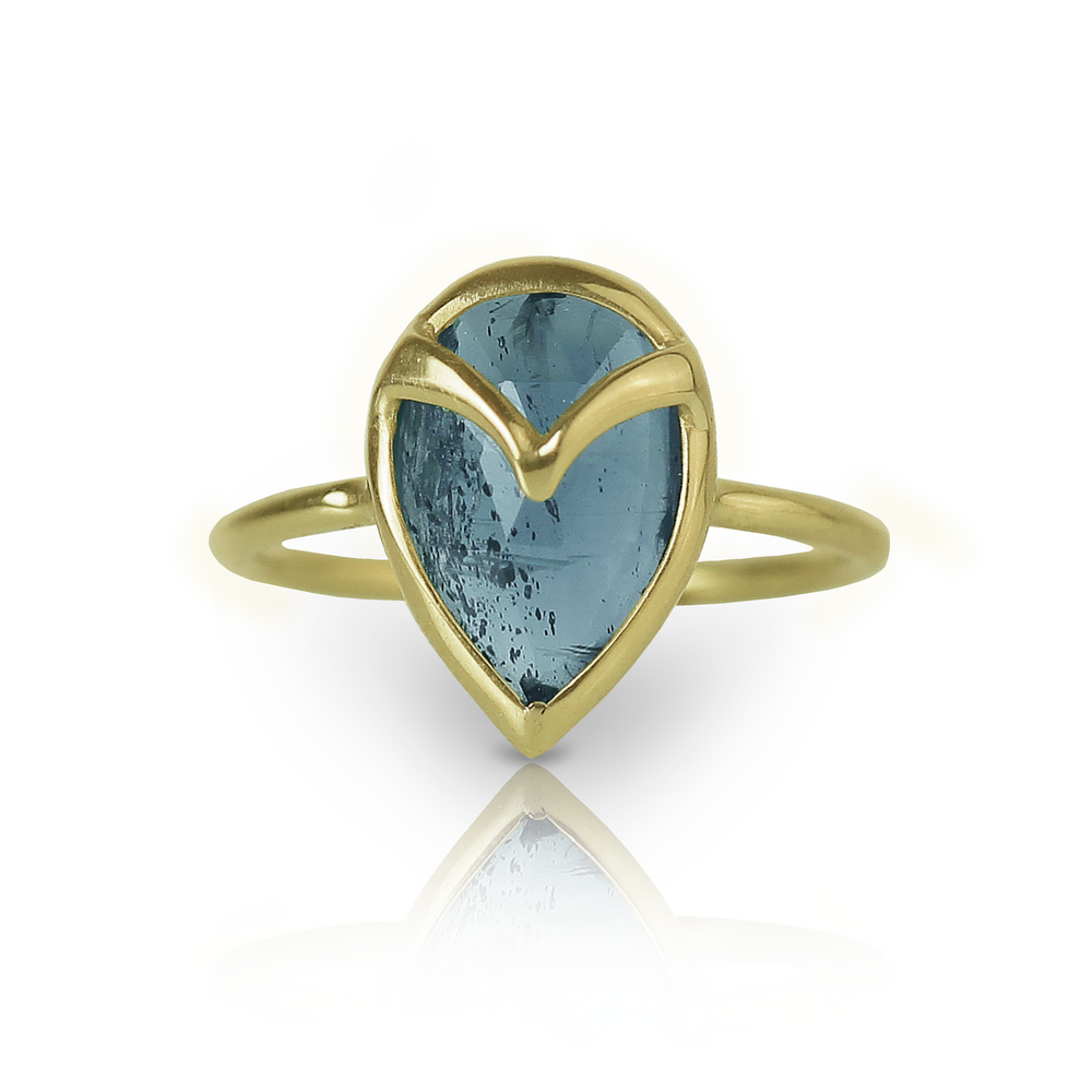 Yellow gold ring with a blue teardrop-shaped kyanite stone, and gold owl beak detail