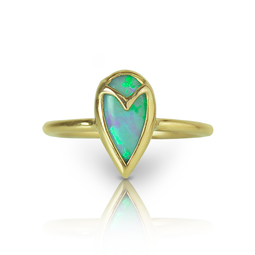 Yellow gold ring with a teardrop-shaped blue and green opal, and gold owl beak detail