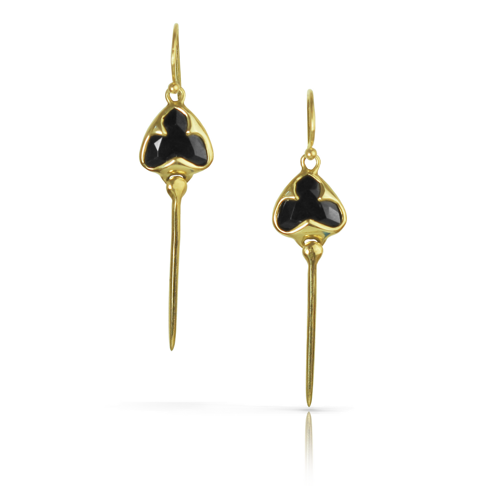 Yellow gold earrings with french hooks, bezel set black onyx stones, and an elongated stingray dangling from the bottom