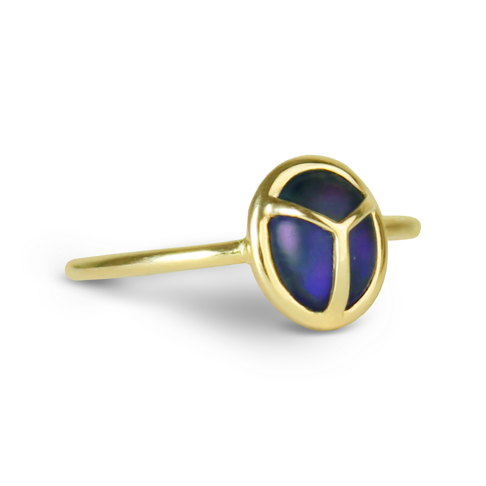 
                  
                    Yellow Gold Ring with Oval Shaped Dark Blue and Purple Matte Opal Stone at a Three Quarter Angle
                  
                