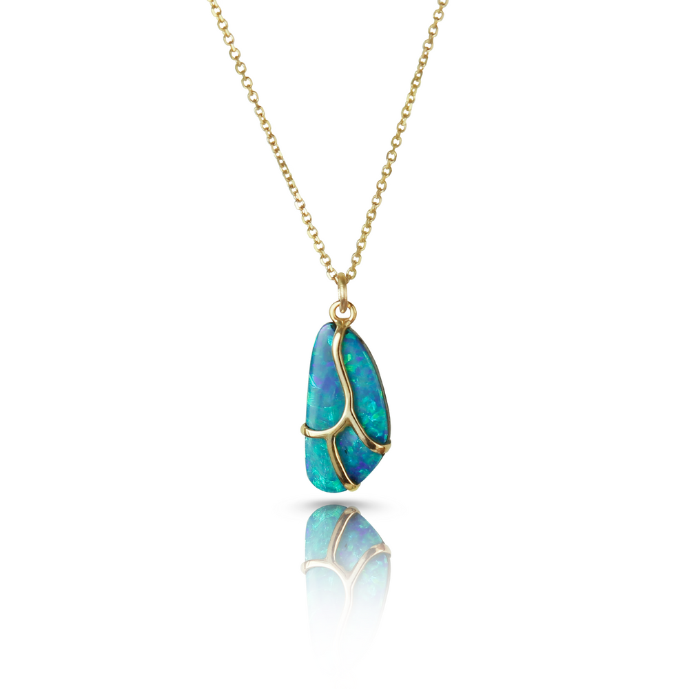Necklace with blue opal stone, yellow gold butterfly wing detail, and gold chain