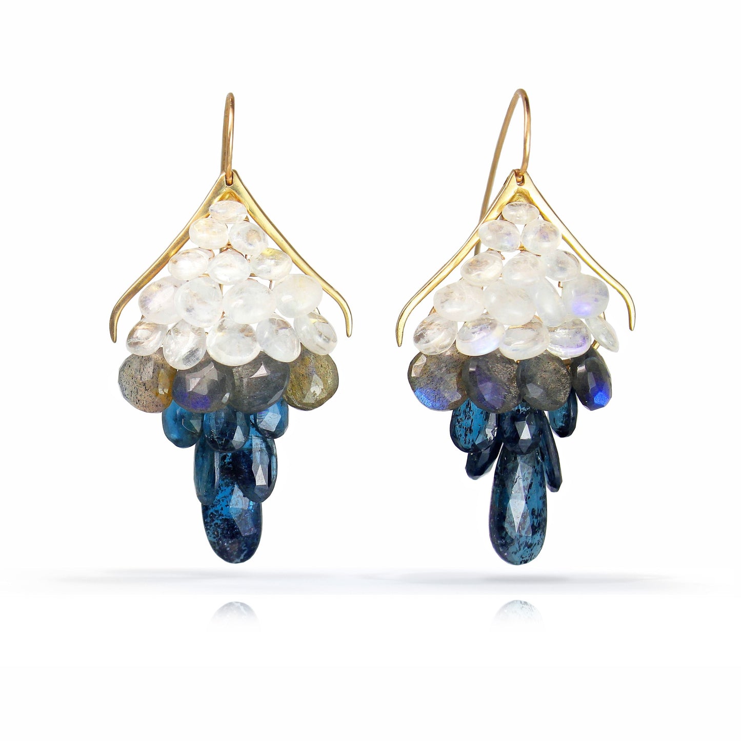 
                  
                    Large Plumage Earrings featuring handpicked ombre gemstones, and elongated ear wires
                  
                